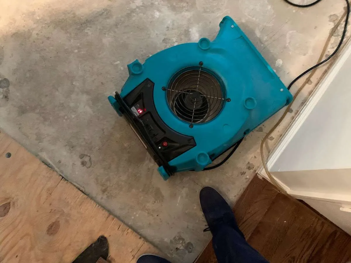Air mover drying subfloor during Leak Detection & Repair in Gettysburg